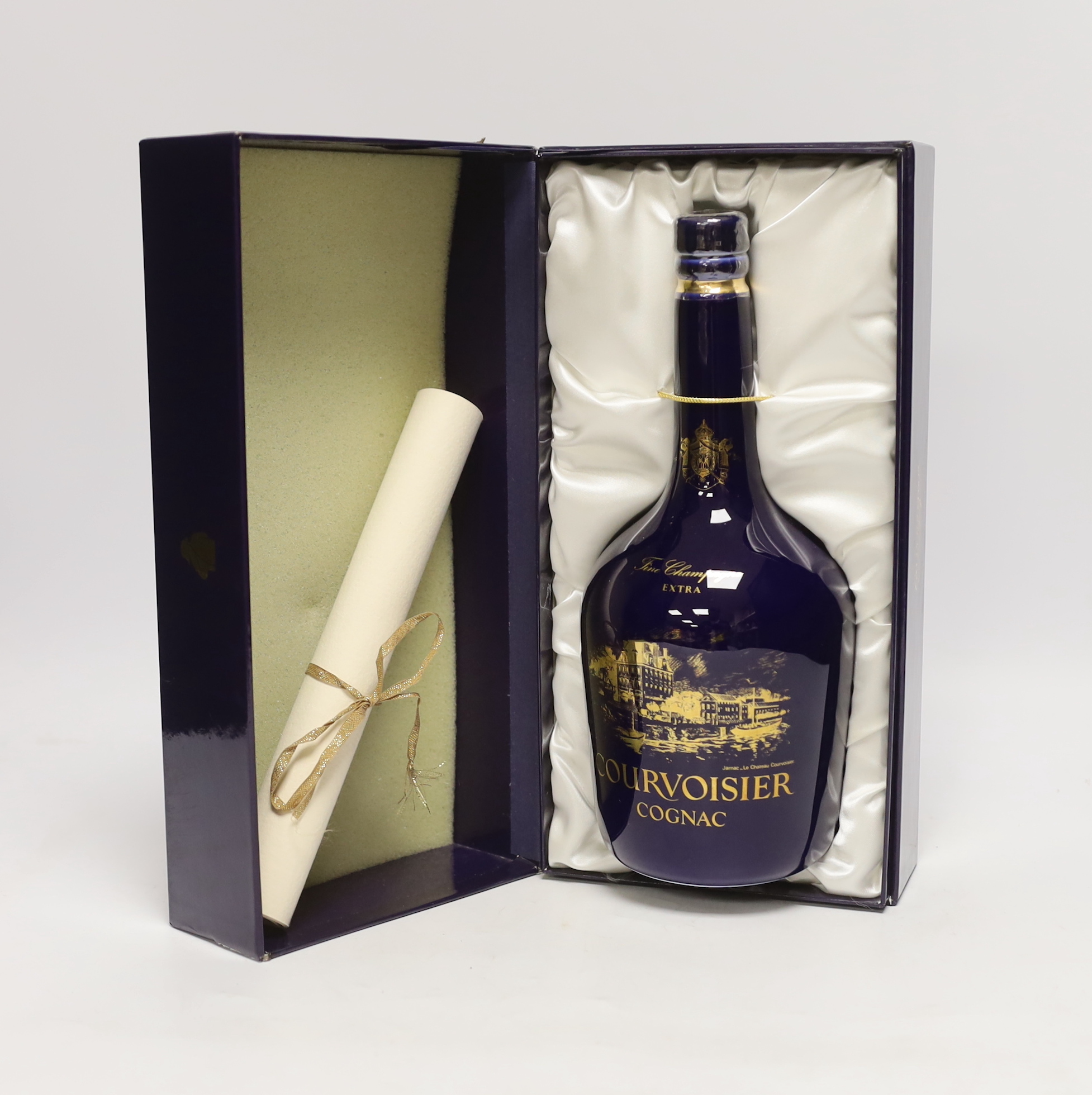 A cased bottle of Chateau Limoges Extra Courvoisier, with scroll